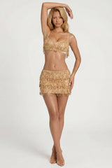 Fringed Low-Rise Mini Skirt in Gold